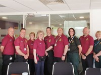 A group of volunteers celebrating at Yorkshire Ambulance Service HQ