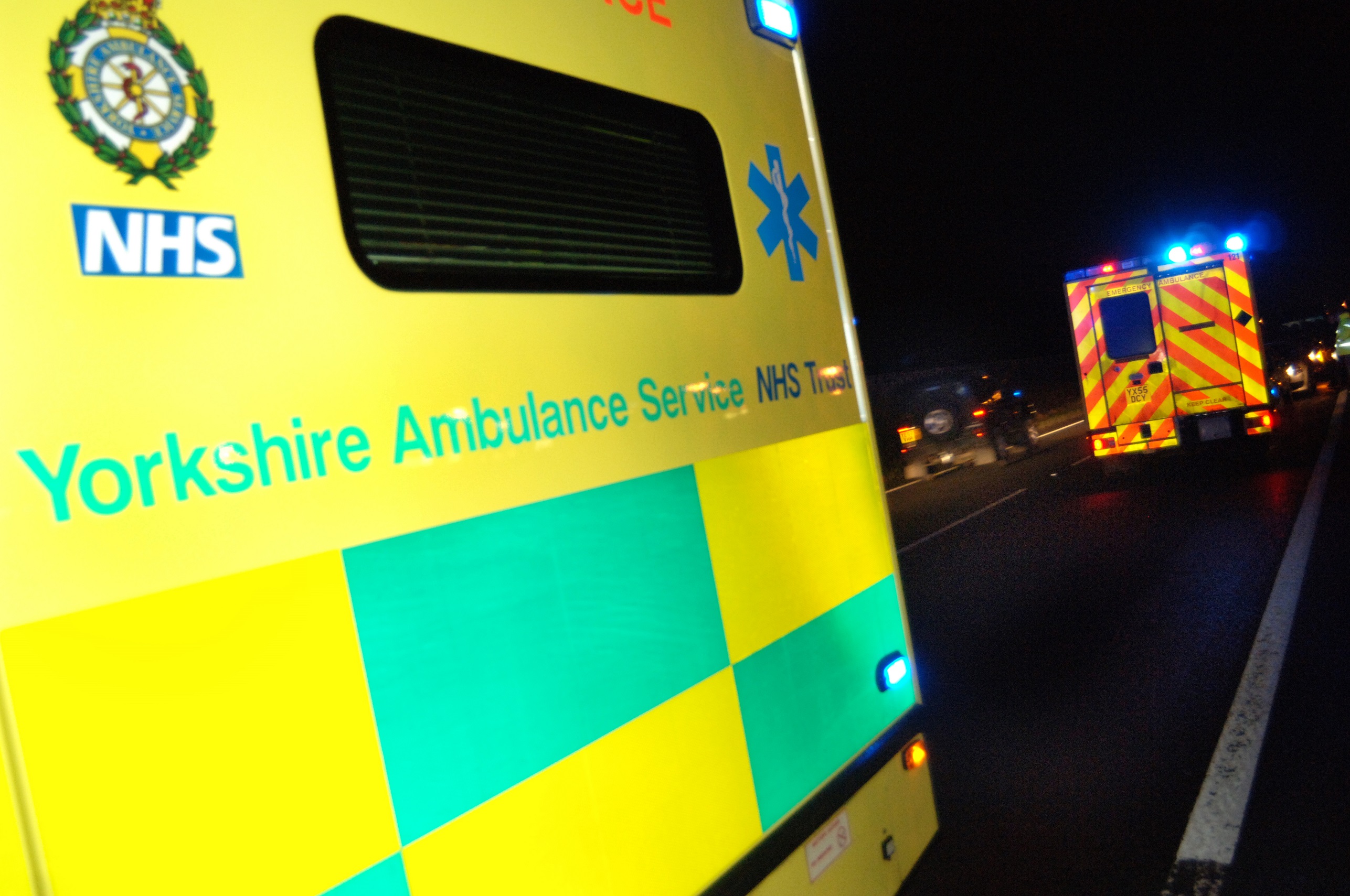 Ambulance on blue lights at night
