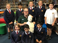 John Spikings, Community Defibrillation Trainer with pupils at Crossley Fields Junior and Infant School