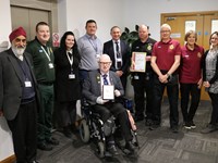 Staff and volunteers celebrate Investing in Volunteers Accreditation