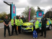 Yorkshire Ambulance Service Staff and Volunteers in uniform, stood with a Rapid Response Vehicle at Crystal Peaks, Sheffield