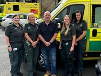 Patient with the ambulance crew who saved his life