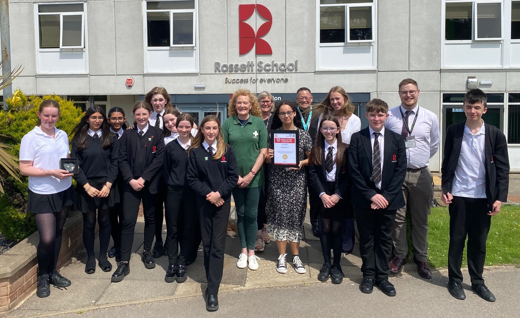 Students and staff at Rossett School in Harrogate celebrating a Heart in the Community Gold Award